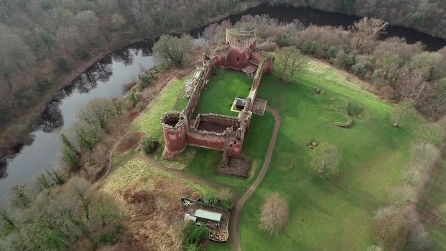 Aerial footage of Bothwell Castle near Uddingston in Scotland. Dramatic location by a winding curve in the River Clyde.