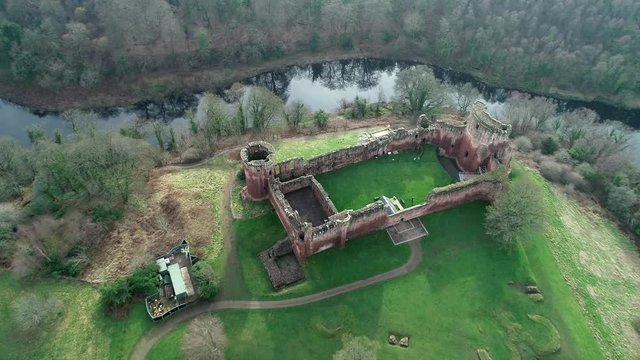 Aerial footage of Bothwell Castle near Uddingston in Scotland. Dramatic location by a winding curve in the River Clyde.