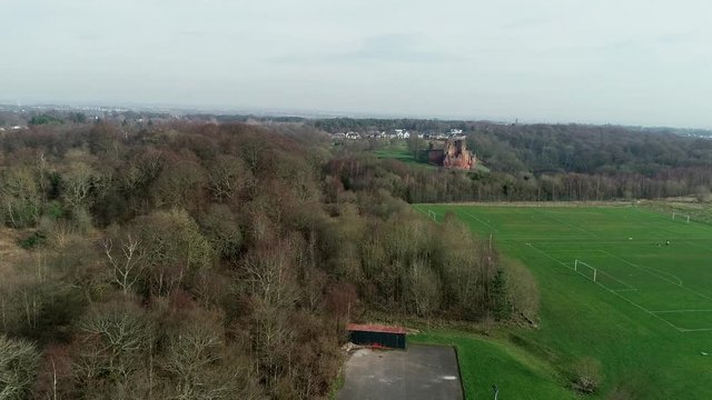 Aerial footage of Bothwell Castle near Uddingston in Scotland. Dramatic location by a winding curve in the River Clyde.