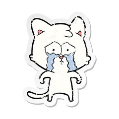 distressed sticker of a cartoon crying cat