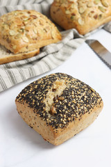 Freshly baked square shaped buns with seeds