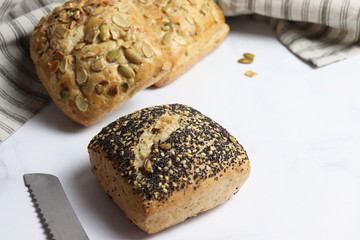 Freshly baked square shaped buns with seeds