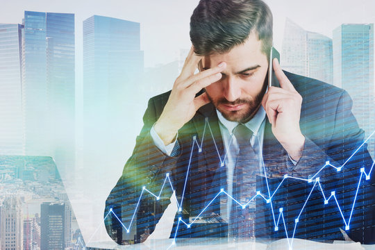 Stressed man with phone in city, graph