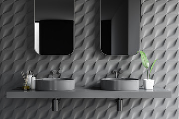 Gray tiled bathroom, double sink