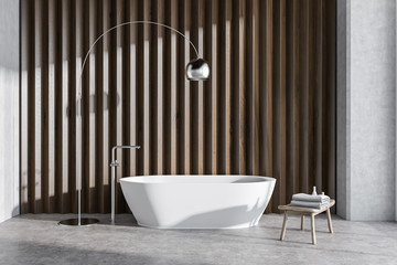 Wooden bathroom interior with tub