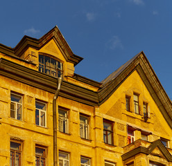 Fragment of town historical houses with mansard