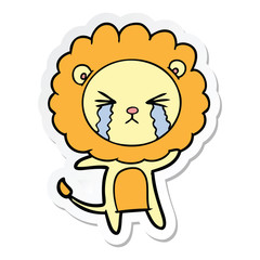 sticker of a cartoon crying lion