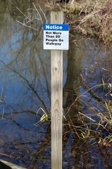 A close view on a small blue and white sign.