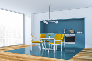 White and blue kitchen corner with table