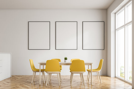 White dining room with poster gallery