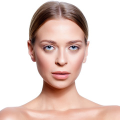 Fototapeta premium Beauty Portrait. Beautiful Spa Woman Touching her Face. Perfect Fresh Skin. Isolated on White Background. Pure Beauty Model. Youth and Skin Care Concept