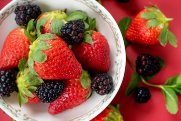 strawberries and blackberries in a bowl