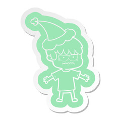 annoyed cartoon  sticker of a boy wearing santa hat