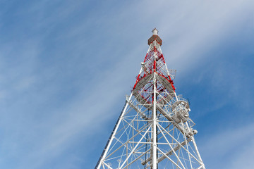 Abstract telecommunication tower Antenna and satellite dish at sky background