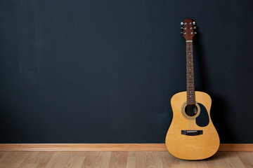 Acoustic guitar  in empty room