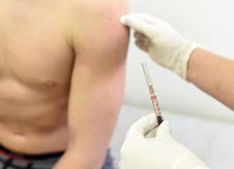  nurse administers a vaccine to a teenager. vaccination, epidemic, health.