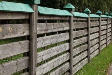 Fototapeta premium Wooden fence stretching into the distance