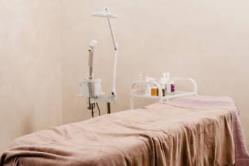 Cosmetologist cabinet with massage table in modern beauty salon