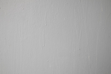 White wall fragment with scratches and cracks 