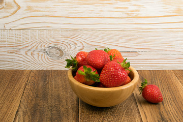 Fresh Strawberry in Bowl on Rustic Wooden Background
