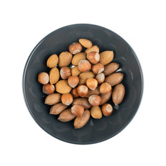 Heap of Macadamia Nuts, Hazelnuts and Almonds in Shell