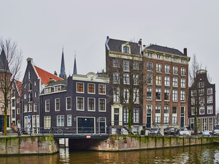 Amsterdam cityscape in the month of January with canals and leaning old houses
