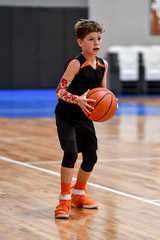 Young boy playing basketball
