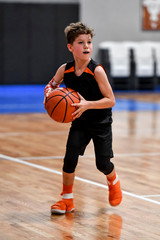 Young boy playing basketball