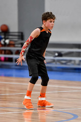 Young boy playing basketball