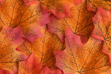 Artificial leaves autumn background abstract.