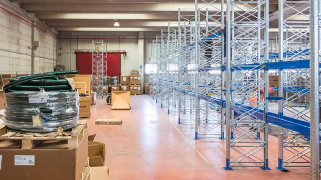 timelapse of industrial shelving assembly, workers at work in a warehouse of an Italian company