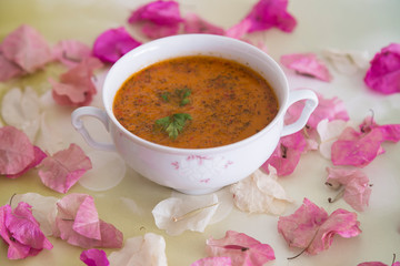 the Tarhana soup in the bowl on the wooden table for kitchen and food concept. 