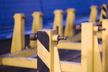 Fototapeta na wymiar Yellow industrial construction with the axles