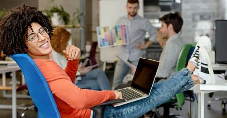 Smiling man enjoying work in modern comfortable cozy co-working space