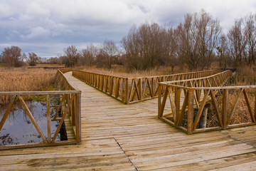 Wooden walkways in the Kopacki Rit Nature Reserve in winter in north east Croatia. Located by the Serbian border, close to the confluence of the Drava and Danube rivers, it is one of the largest and m