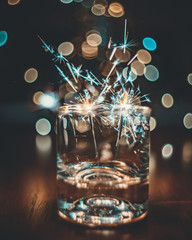 glass of champagne on red background