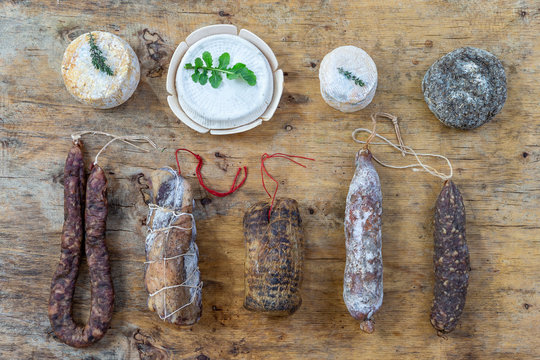 Corsican wild pork delicatessen, and cheese specialities, made in Corsica France on wooden background