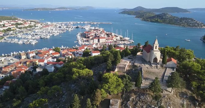 Aerial View of the Harbor and Church of Tribunj - Croatia / Smooth drone Sho