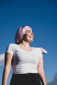 Young beautiful woman with cancer bandana