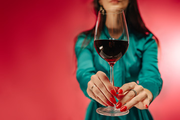 Modern sommelier estimating smell of wine in wineglass. Forever young.