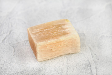 Natural mineral - rough Selenite, Gypsum crystal from Kungur, Ural, Russia on white cement background.