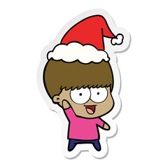 happy sticker cartoon of a boy waving wearing santa hat