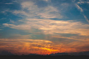Italian sunset, blue cloudy sky on golden hour