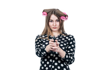 business woman in hair curlers with gun