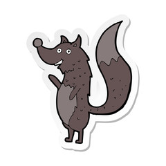 sticker of a cartoon waving wolf