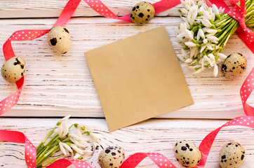 Easter egg and spring flowers on a wooden background . - Image