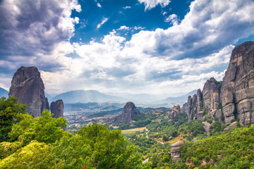 Fototapeta na wymiar The Meteora with dramatic overcast sky, a rock formation hosting built complexes of monasteries, Greece, Europe.