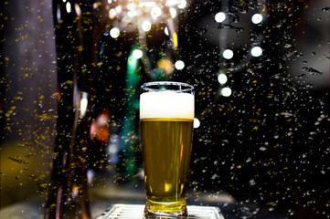 glass of beer on a black background