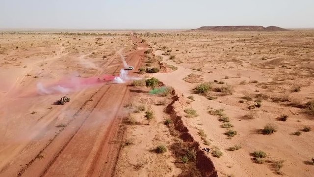 Aerials over a simulated ambush army commando raid and hostage situation on a remote African road in Niger.