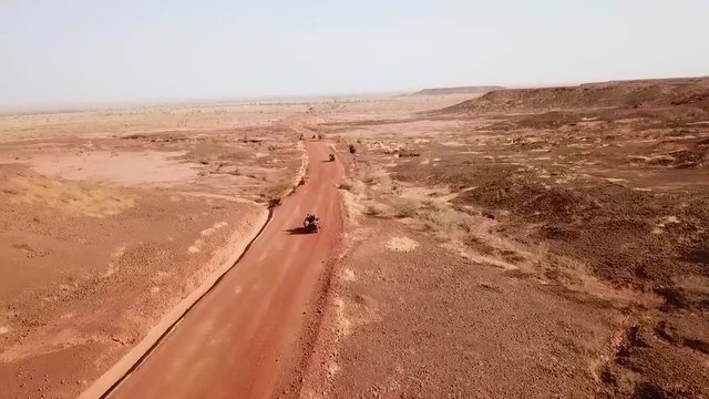 Aerials over a simulated ambush army commando raid and hostage situation on a remote African road in Niger.
